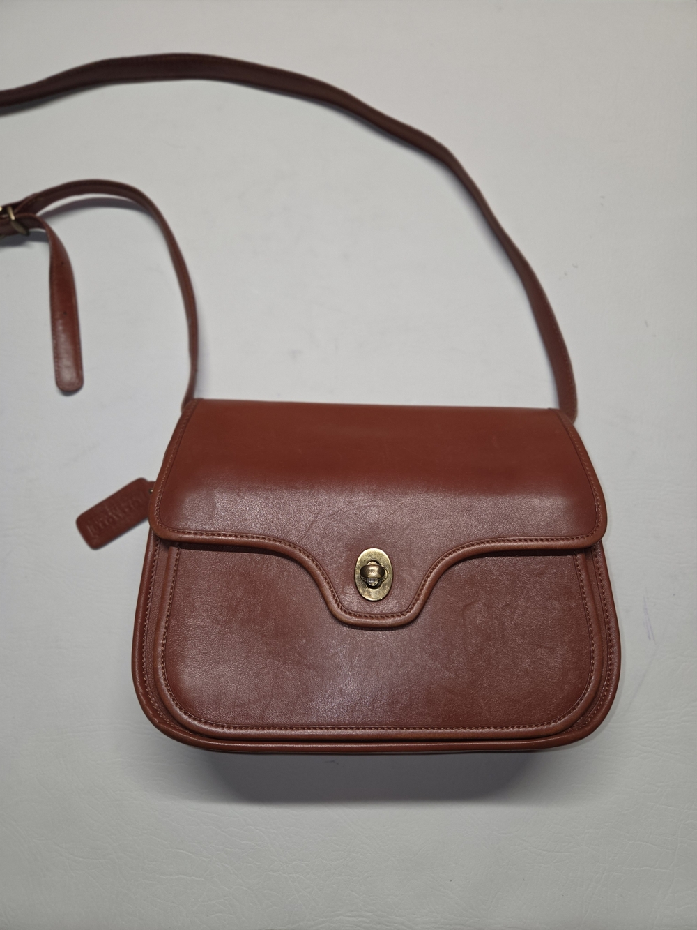 Vintage Coach Kent Crossbody bag crafted from brown leather 70S Gold Hardware